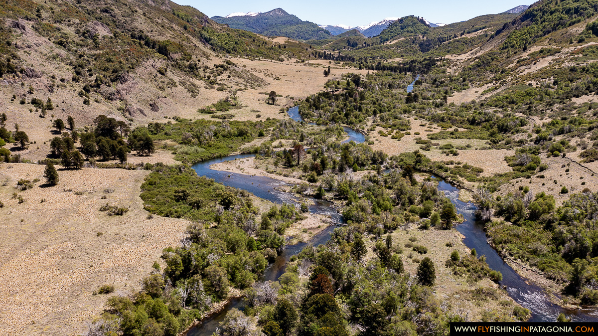 Aerial view of the Huaca Mamuil River winding through a remote Patagonian valley