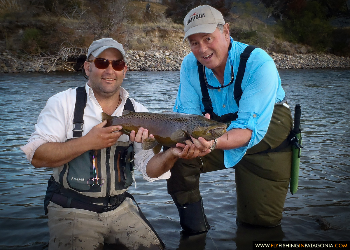 Guide and angler with a trout caught on the Traful River