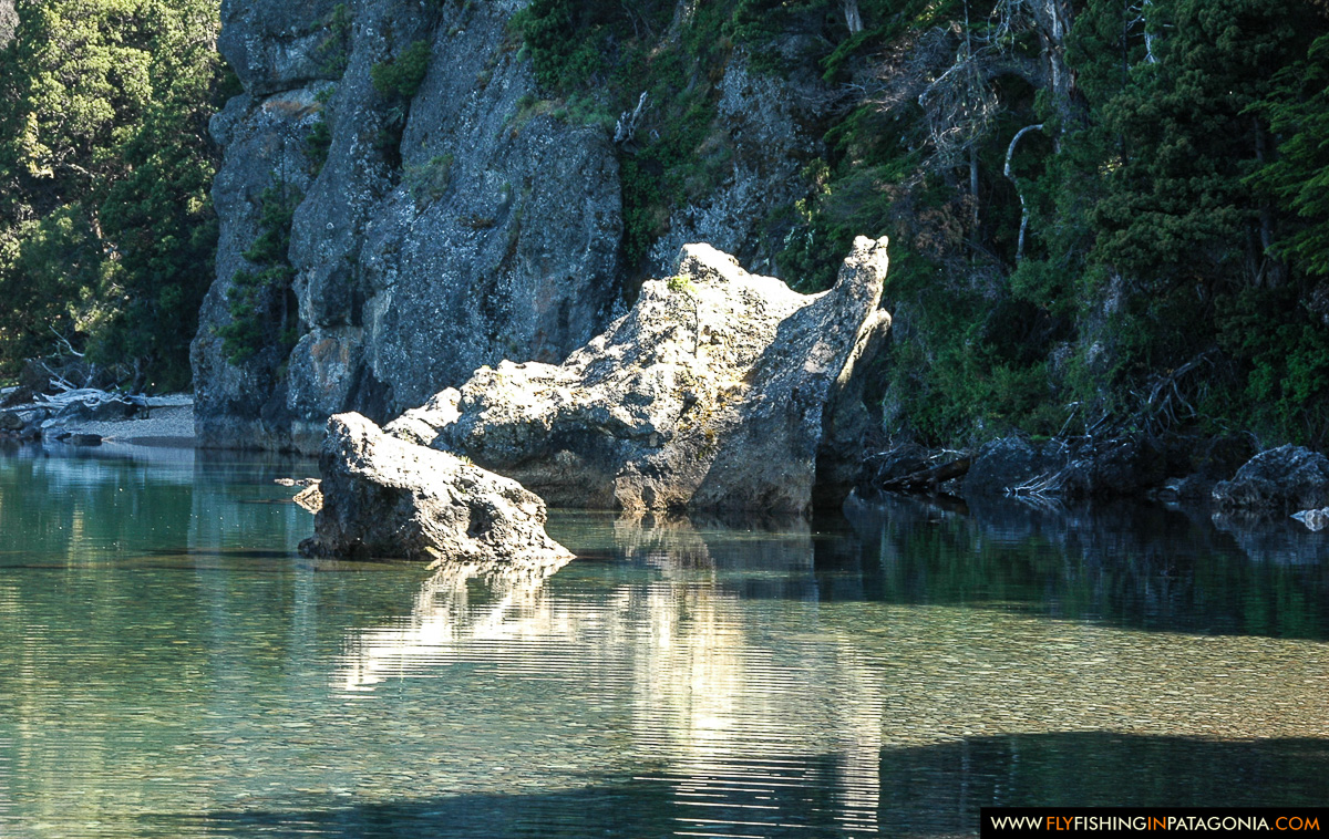 Distinctive rock formation in a crystal-clear Traful pool