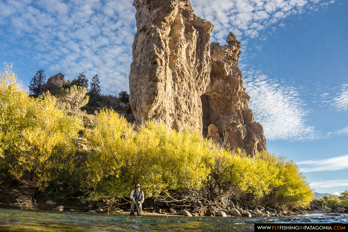 Rock spire and autumn colors beside the Traful River