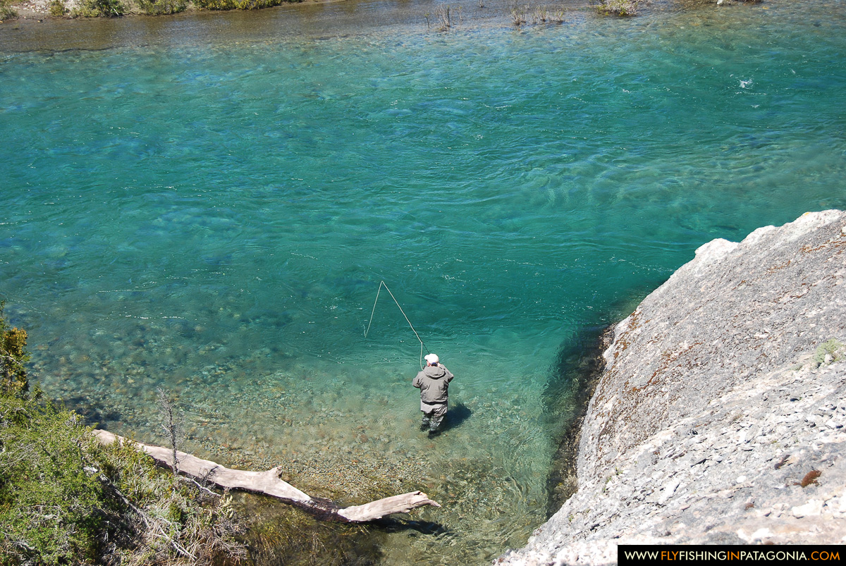 Sight-fishing in a turquoise Traful River pool