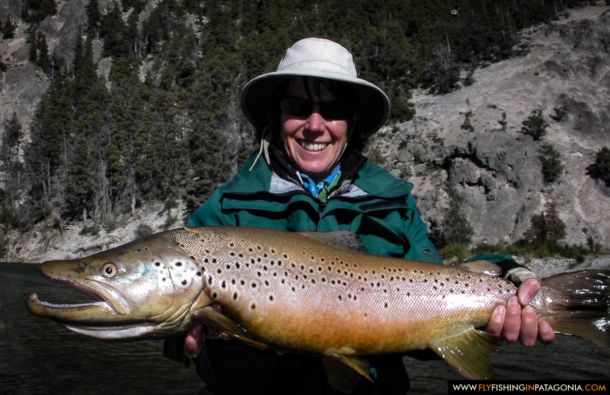 Woman holding a giant Traful River brown trout