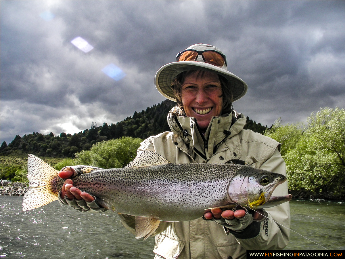 Woman presenting a wild Traful River rainbow trout